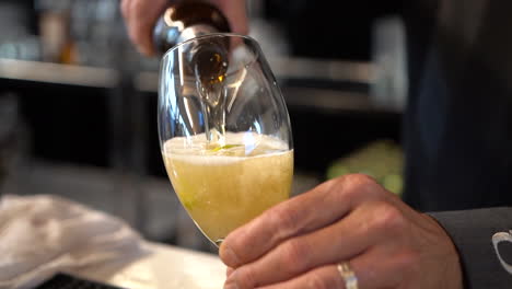 Slow-motion-shot-of-a-man-pouring-a-cold-beer