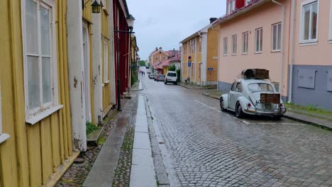 Small-town-with-colorful-houses-and-parked-vehicles