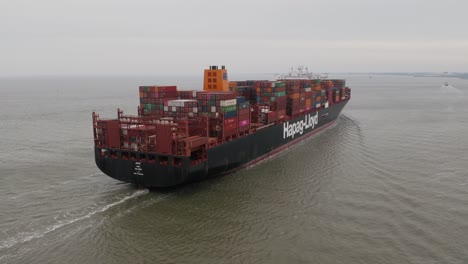 Close-Aerial-Shot-from-the-back-of-a-Big-Containership-travelling-towards-the-port-of-Cuxhaven-in-the-North-Sea