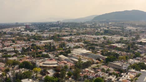 Drone-aerial-view-of-the-Ciudad-Granja-neighborhood-and-it's-surroundings-in-Zapopan,-Jalisco,-Mexico