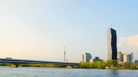 Still-wide-shot-over-Vienna-Skyline-through-Danube-river,-Austria