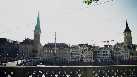 View-of-Zurich-historic-city-center-with-famous-Fraumunster-Church-and-river-Limmat-at-Lake-Zurich-from-Grossmunster-Church-on-a-sunny-day-in-summer,-Canton-of-Zurich,-Switzerland