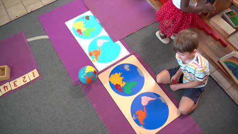 African-Girl-and-Caucasian-Boy-playing-in-Montesorri-School