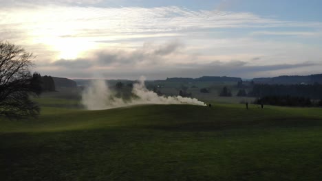 Drone-flying-over-smoke-on-day-with-clouds