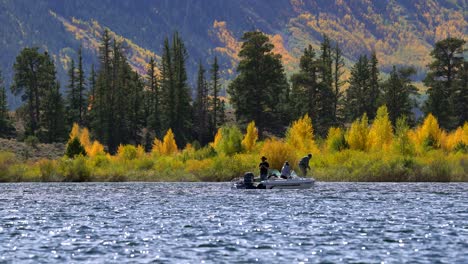 Men-fishing-in-a-lake-against-a-background-of-fall-colors-in-the-Rocky-Mountains-of-Colorado