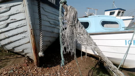 Close-up-of-ropes-moving-in-the-breeze-attached-to-boats,-Static