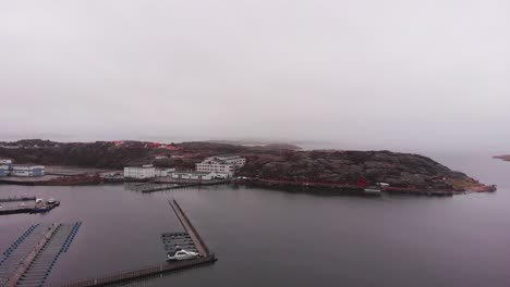 Flying-over-the-peaceful-and-Famous-city-of-Lyseki,-Sweden-Composed-Of-Unique-Buildings-With-Landscape-Surrounded-By-The-Calm-Sea---Aerial-shot