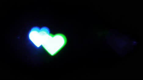 Beautiful-hearts-bokeh-from-flashing-lights,-Valentines-Day,-wedding-day-or-social-media-Like-background-concept