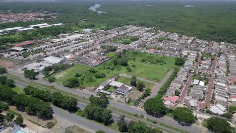 Aerial-drone-view-in-4k-of-gated-communities-outside-Guayaquil-City,-Ecuador-and-the-main-highway-going-to-Via-a-la-Costa