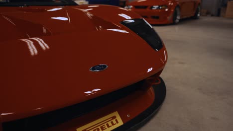 Arc-Shot-of-Front-End-of-a-Shiny-Red-Ford-GT-GT3-Super-Car