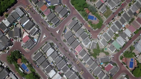 Aerial-drone-top-view-in-4k-of-gated-communities-outside-Guayaquil-City,-Ecuador-Trees,-houses,-parks-can-be-seen-straight-down-by-flying-over-them