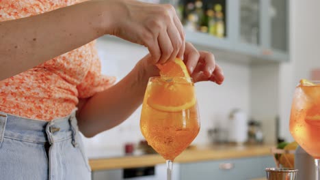 Woman-Making-Cocktail-Drinks-at-Home-Kitchen.drinks-and-people-concept--young-woman-making-strawberry-mojito-cocktail-at-home-kitchen