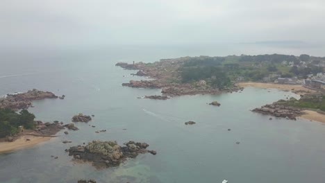 Aerial-Drone-view-above-French-Bretagne-granite-coast-on-cloudy-time-and-fog