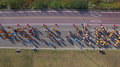 People-who-walk-and-run-in-groups-with-drone-top-view-follow-shot