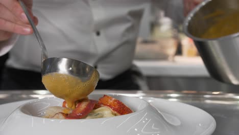 French-chef-plating-a-luxurious-fine-dining-dish-slow-motion-close-up-shot