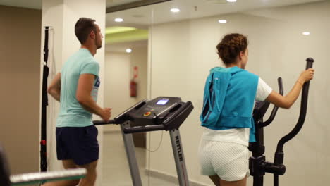 Man-and-woman-having-cardio-workout-at-the-gym