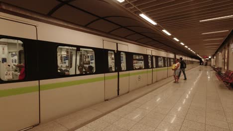 Underground-train-arriving-on-platform-in-Athens,-Greece