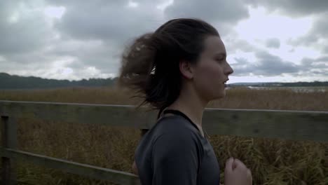 female-runner-running-through-the-forest