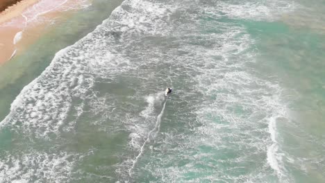 Following-Kite-Surfer-with-drone-at-Kite-Beach,-Cabo-Verde