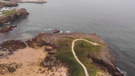 Cliff-walk-in-incredible-environment,-drone-high-angle