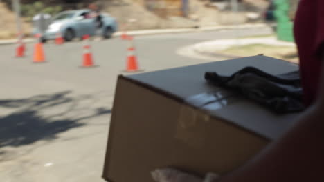 Woman-Carries,-Delivers-Los-Angeles-Food-Bank-Box-During-Covid-19-Coronavirus-Pandemic