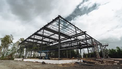 Construction-Workers-Installing-Trusses-With-A-Mobile-Crane-At-The-Construction-Site-In-Sherbrooke,-Quebec,-Canada---timelapse