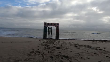 Swing-on-an-abandoned-concrete-pier-overlooking-the-ocean