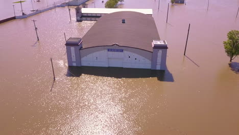 Aerial-push-out-of-exhibition-building-at-flooded-Ionia-County-Fair