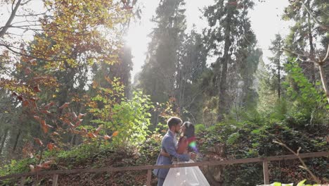 Groom-with-bride-near-mountain-hills-in-the-forest.-Wedding-couple.-Sunbeams