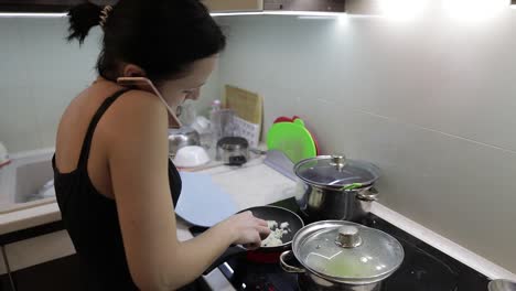 Beautiful-caucasian-woman-talking-on-the-phone-while-cooking