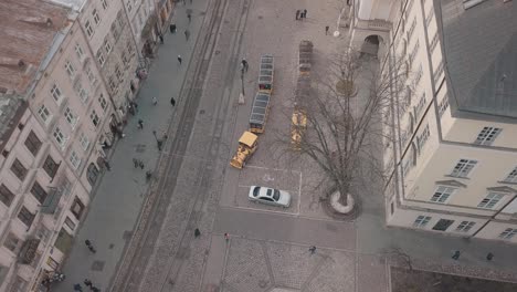 Aerial-City-Lviv,-Ukraine.-European-City.-Tourist-tram-rides-down-city-center