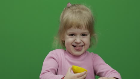 Beautiful-young-girl-eats-a-lemon-with-a-grimace-on-her-face.-Chroma-Key