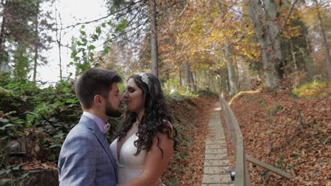 Groom-with-bride-near-mountain-hills-in-the-forest.-Couple.-Making-a-kiss