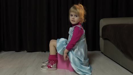 Little-girl-sitting-on-the-potty-and-watching-TV