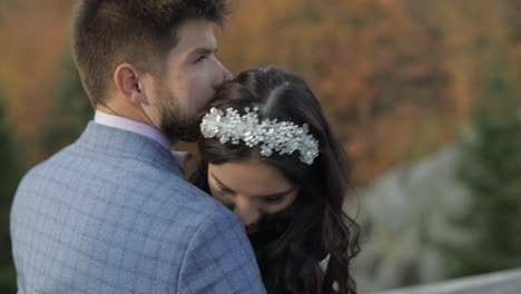 Groom-with-bride-on-a-mountain-hills-in-the-forest.-Wedding-couple