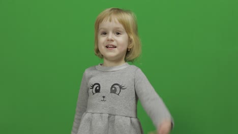 Kid-girl-on-a-Green-Screen,-Chroma-Key.-Happy-three-years-old-girl