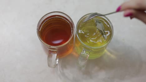 Close-video-of-making-a-cup-of-green-tea-with-a-fresh-tea-bag-in-hot-water