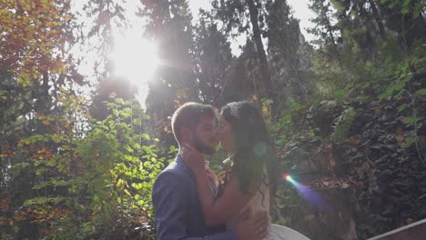 Groom-with-bride-near-mountain-hills-in-the-forest.-Wedding-couple.-Sunbeams