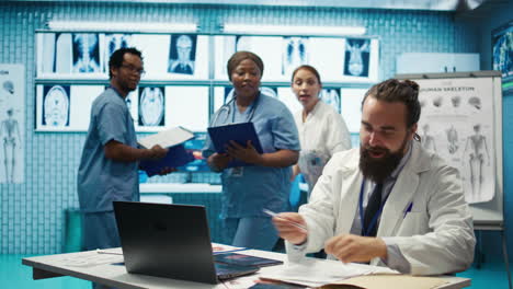 Happy-team-of-medics-sharing-a-high-five-after-successful-research-session