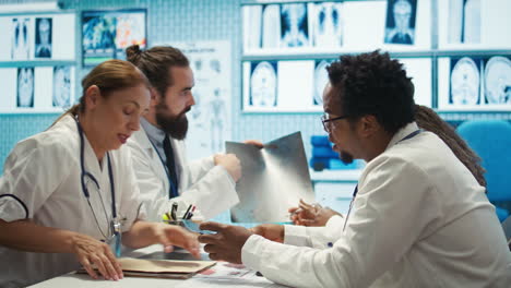 Radiologists-and-specialists-examine-x-rays-and-discuss-medical-care