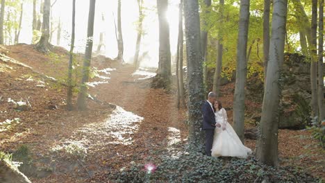 Groom-with-bride-in-the-forest-park.-Wedding-couple.-Happy-family