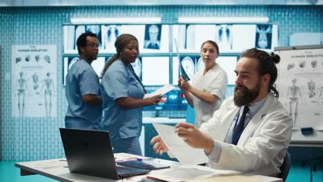 Confident-pleased-medical-staff-share-high-five-to-celebrate-diagnostic-success