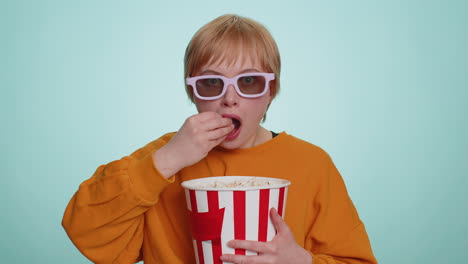 Woman-in-3D-glasses-eating-popcorn-and-watching-interesting-tv-serial,-sport-game-film,-online-movie