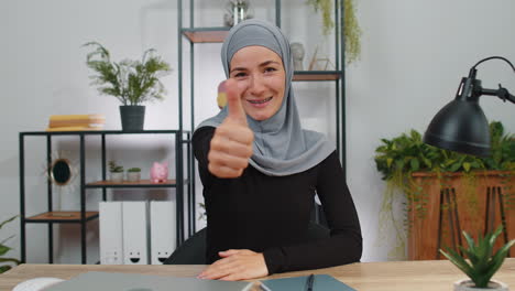 Happy-muslim-business-woman-showing-thumbs-up,-like-sign-positive-something-good,-positive-feedback