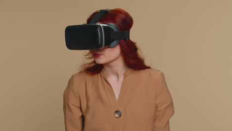 Young-woman-using-virtual-reality-headset-helmet-to-play-simulation-game-app,-watching-video-content