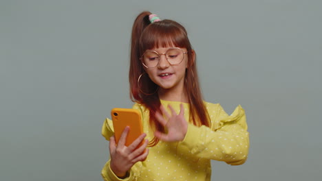 Child-girl-kid-blogger-taking-selfie-on-smartphone-communicating-video-call-online-with-subscribers