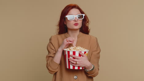 Excited-woman-in-3D-glasses-eating-popcorn-and-watching-interesting-tv-serial,-sport-game-film-movie