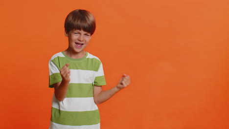 Child-boy-kid-showing-thumbs-up-and-pointing-on-blank-space-place-for-advertisement-promotion-logo