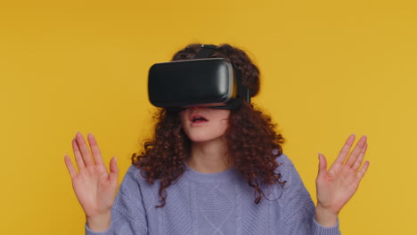 Young-woman-using-virtual-reality-headset-helmet-to-play-simulation-game-app,-watching-video-content