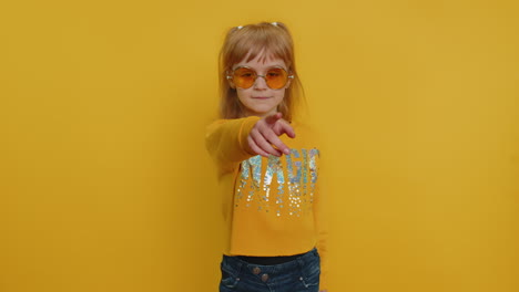 Child-girl-kid-smiling-excitedly-and-pointing-finger-to-camera,-choosing-lucky-winner,-indicating